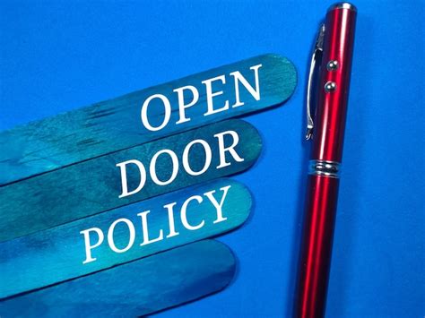 Premium Photo Text Open Door Policy With Pen On Blue Background Premium Photo Text Open Door Policy With Pen On Blue Background