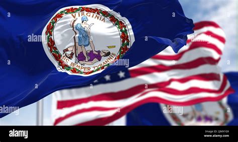 The Virginia State Flag Waving Along With The National Flag Of The The Virginia State Flag Waving Along With The National Flag Of The