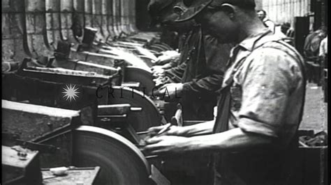 Workers At Machinery Manufacture Rifles In A Factory In The United Workers At Machinery Manufacture Rifles In A Factory In The United